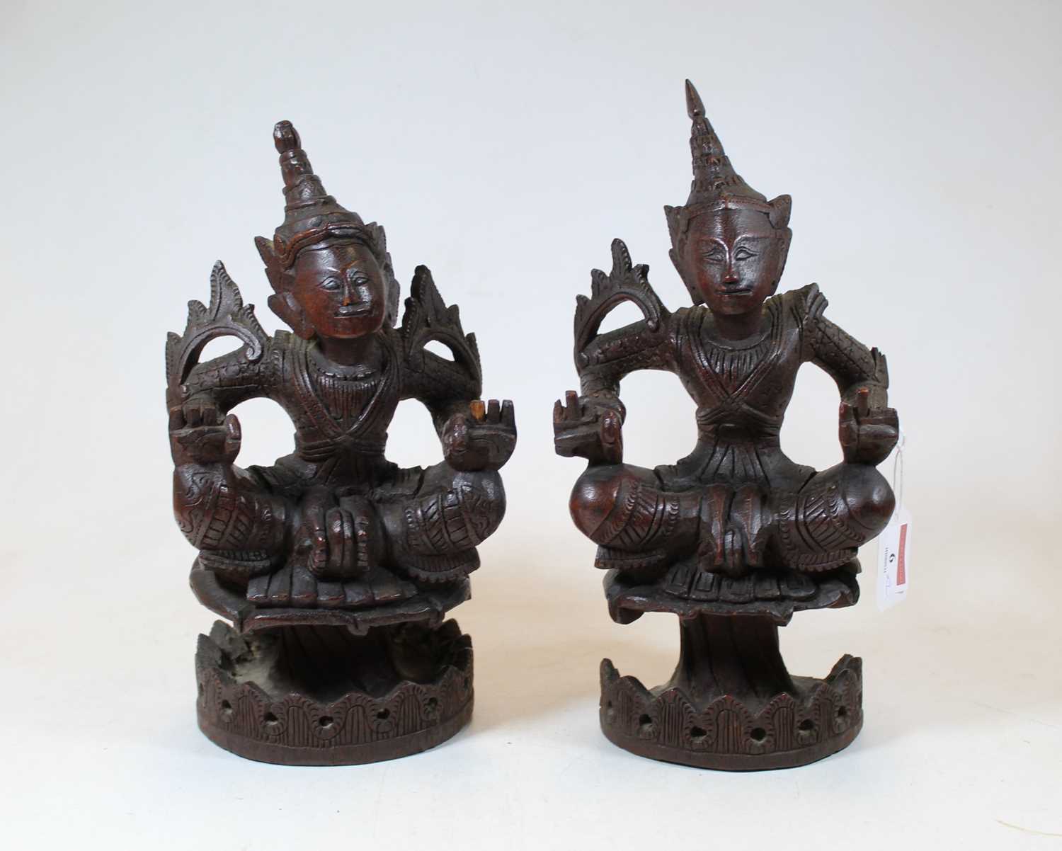 Lot 6 - A pair of 20th century Eastern carved hardwood...