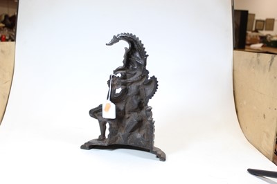 Lot 14 - A 20th century cast iron door-stop in the form...