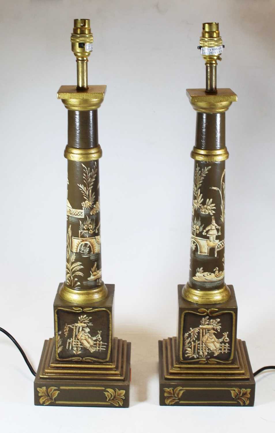 Lot 21 - A pair of reproduction turned wood table lamps...