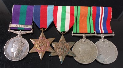 Lot 2139 - A group of five medals to include a George VI...