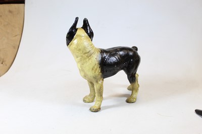 Lot 50 - A painted cast iron model of a pug dog, shown...