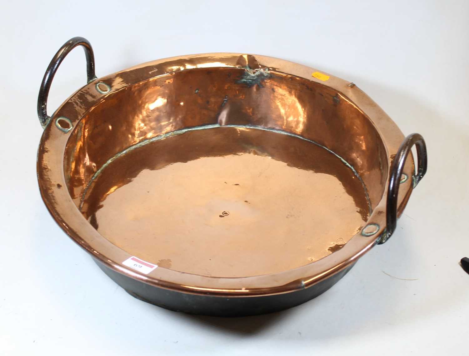 Lot 69 - A Victorian copper preserve pan, flanked by...