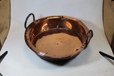 Lot 69 - A Victorian copper preserve pan, flanked by...