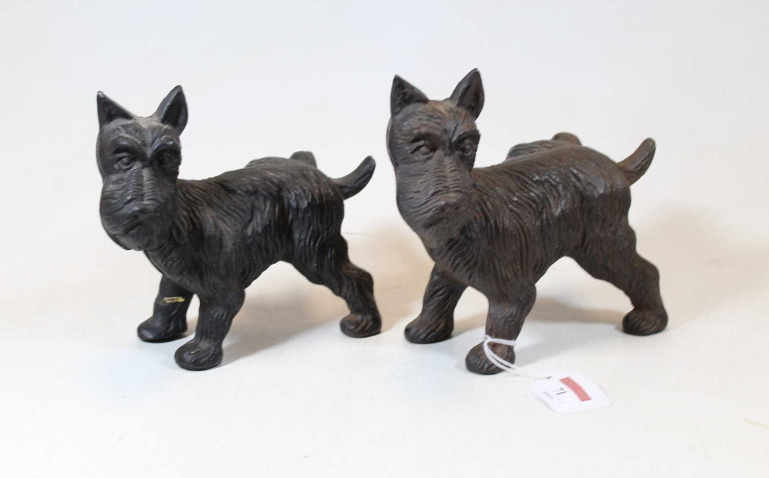 Lot 71 - Two cast iron models of Terriers, each shown...