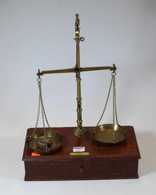 Lot 111 - An early 20th century brass beam scale, h.44cm