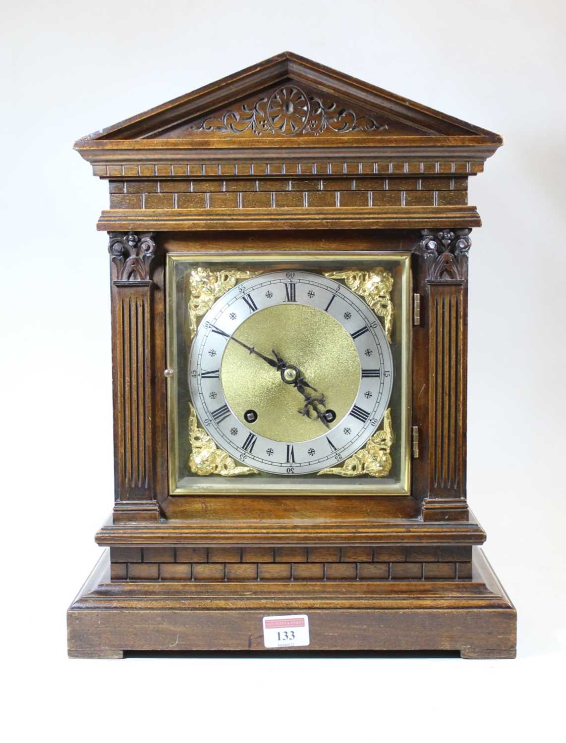 Lot 133 - A circa 1900 German walnut cased mantel clock...