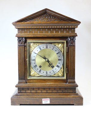 Lot 133 - A circa 1900 German walnut cased mantel clock...