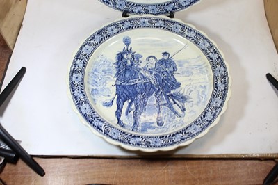 Lot 140 - A pair of Dutch Delft style chargers, each...