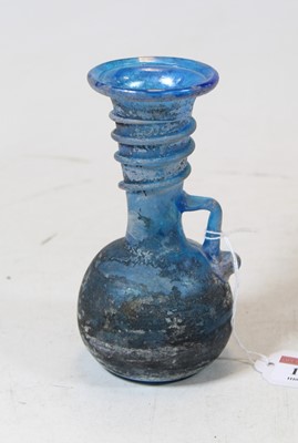 Lot 198 - A Roman style blue glass vase, the flared rim...