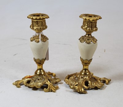 Lot 201 - A pair of lacquered brass and polished...