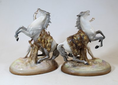 Lot 202 - A pair of 19th century porcelain figure groups...