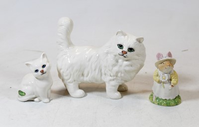 Lot 211 - A Beswick porcelain model of a cat, together...