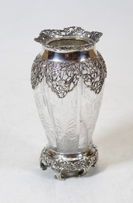 Lot 273 - An Edwardian cut glass vase of fluted form...