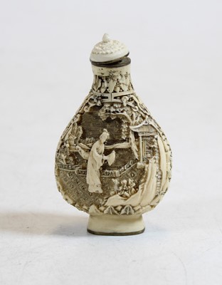Lot 315 - A resin snuff bottle decorated with a figure...
