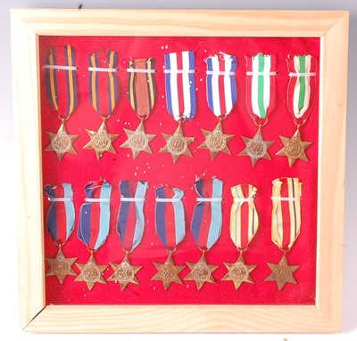 Lot 2107 - A framed collection of fourteen WW II Stars to...