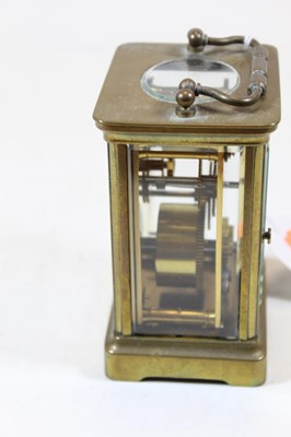 Lot 32 - A French lacquered brass carriage clock,...