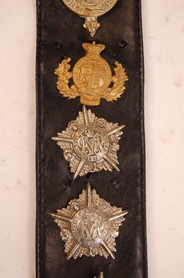 Lot 2186 - A collection of cap badges and insignia to...
