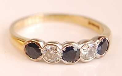 Lot 3099 - An 18ct yellow and white gold, sapphire and...