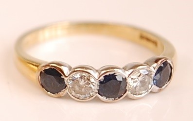 Lot 3099 - An 18ct yellow and white gold, sapphire and...