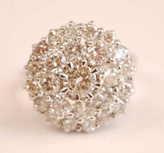 Lot 3124 - A white metal diamond circular cluster ring,...