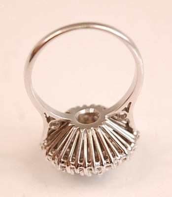 Lot 3124 - A white metal diamond circular cluster ring,...