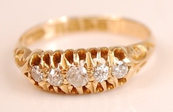 Lot 3097 - An 18ct yellow gold diamond five-stone half...