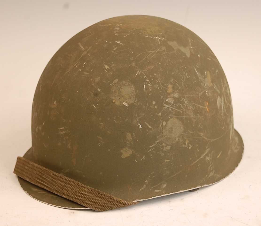 Lot 2414 - A Spanish F1 steel helmet with leather liner...