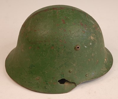 Lot 2417 - A Bulgarian M36 steel helmet, having a leather...