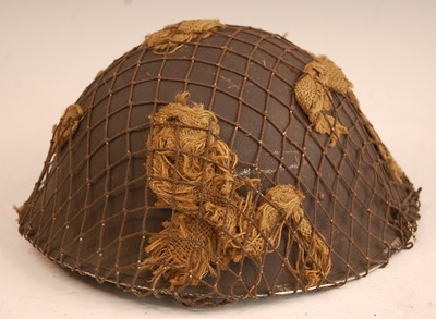 Lot 2426 - A WW II British Mk III steel helmet, having a...