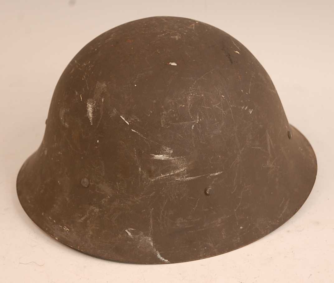 Lot 116 - A Swedish M1926 steel helmet with leather...