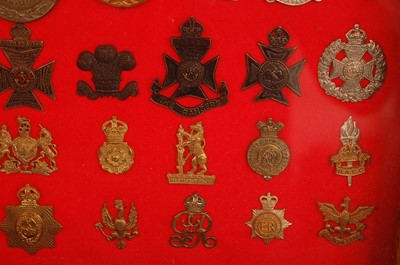 Lot 2221 - A collection of cap badges and insignia to...