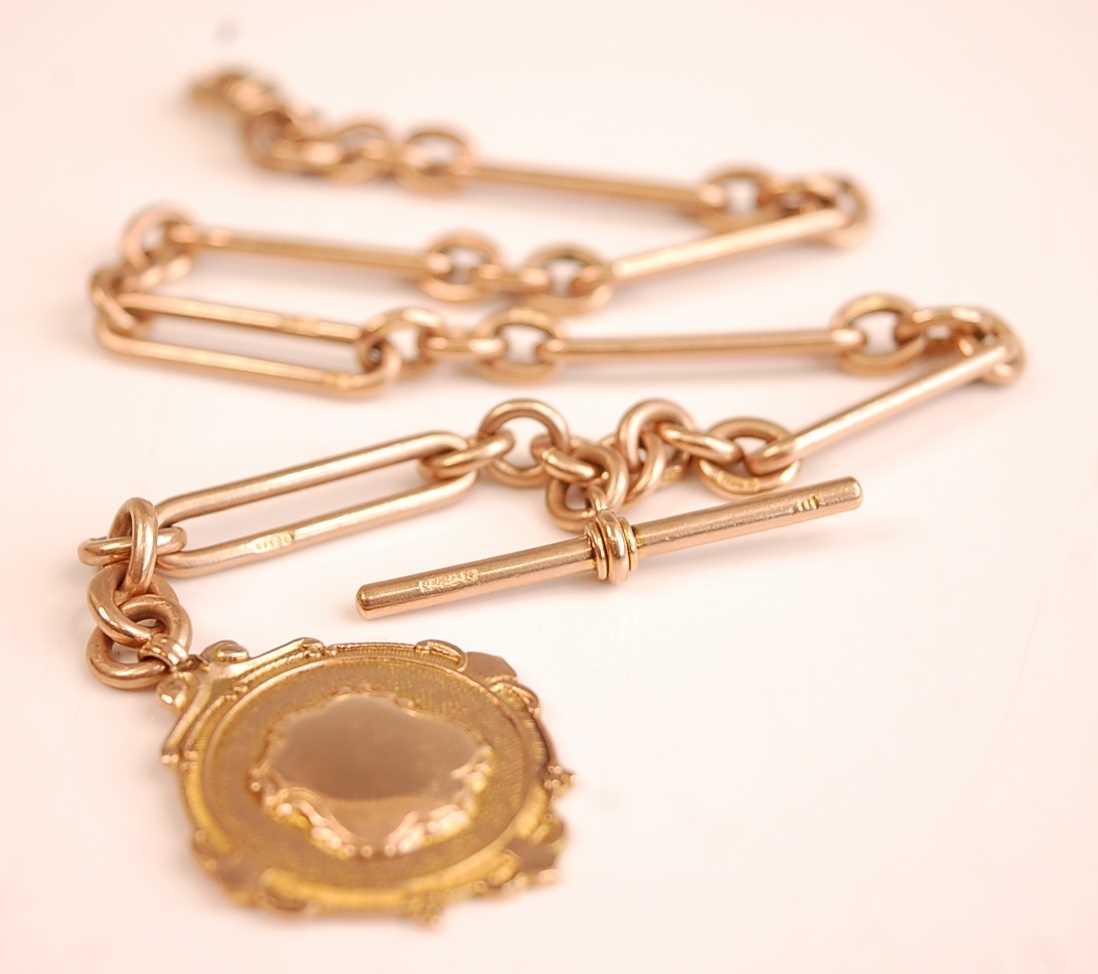 Lot 3159 - A 9ct gold fetter and three link watch chain,...