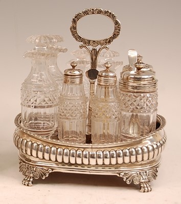 Lot 3053 - A George III silver eight-bottle cruet, of...