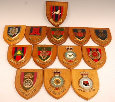 Lot 2379 - A collection of Regimental wall plaques to...