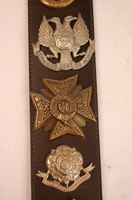 Lot 2193 - A collection of cap badges, glengarry badges...