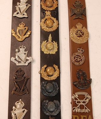 Lot 2202 - A collection of cap badges and insignia to...