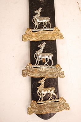 Lot 2203 - A collection of cap badges and insignia to...