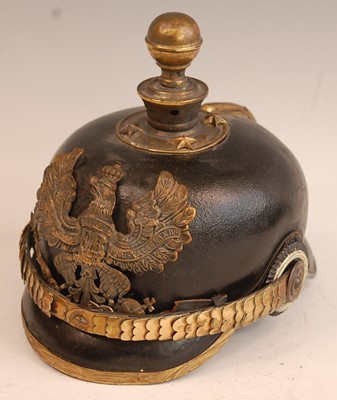 Lot 2435 - A Prussian pickelhaube, the leather skull with...