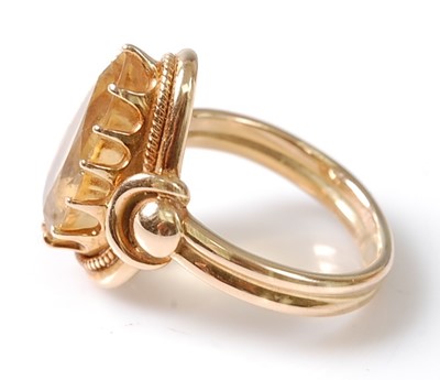 Lot 3130 - A yellow metal citrine dress ring, featuring a...