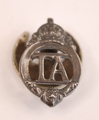 Lot 2438 - A Territorial Army lapel badge, numbered verso...