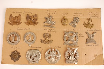 Lot 2207 - A collection of cap and glengarry badges to...