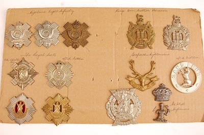 Lot 2207 - A collection of cap and glengarry badges to...