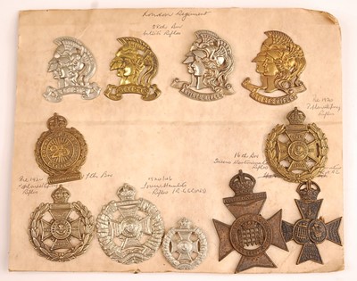 Lot 2210 - A collection of cap and collar badges to...