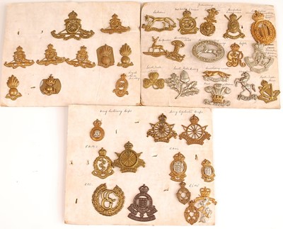 Lot 2211 - A collection of cap and collar badges to...