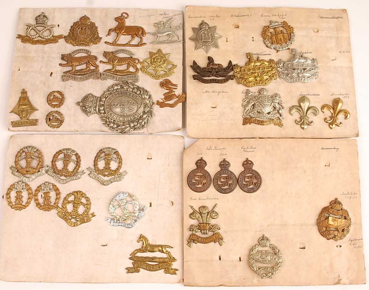 Lot 2212 - A collection of cap badges, glengarry badges...