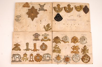Lot 2213 - A collection of cap badges and insignia to...