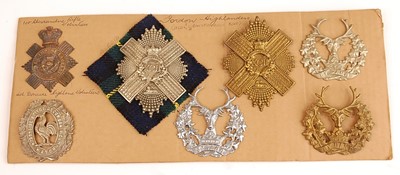 Lot 2214 - A collection of seven glengarry badges to...