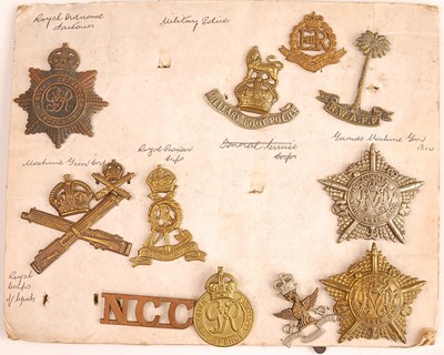 Lot 2215 - A collection of cap badges and insignia to...