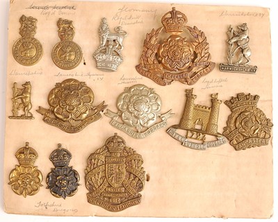 Lot 2216 - A collection of cap badges and insignia to...