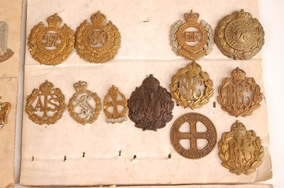 Lot 2217 - A collection of cap badges, lapel badges and...